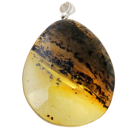 großer gelb-schwarzer Tropfen aus Bernstein mit einer schräg verlaufenden Banderole aus Einschlüssen, fast wie die Ringe des Saturn Tikiwe Bernsteinschmuck
