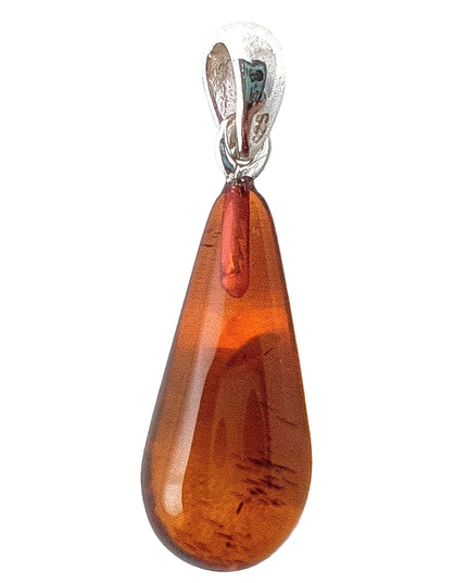 Bernsteintropfen 3 kurz mit 2 Euromünze als Größenvergleich